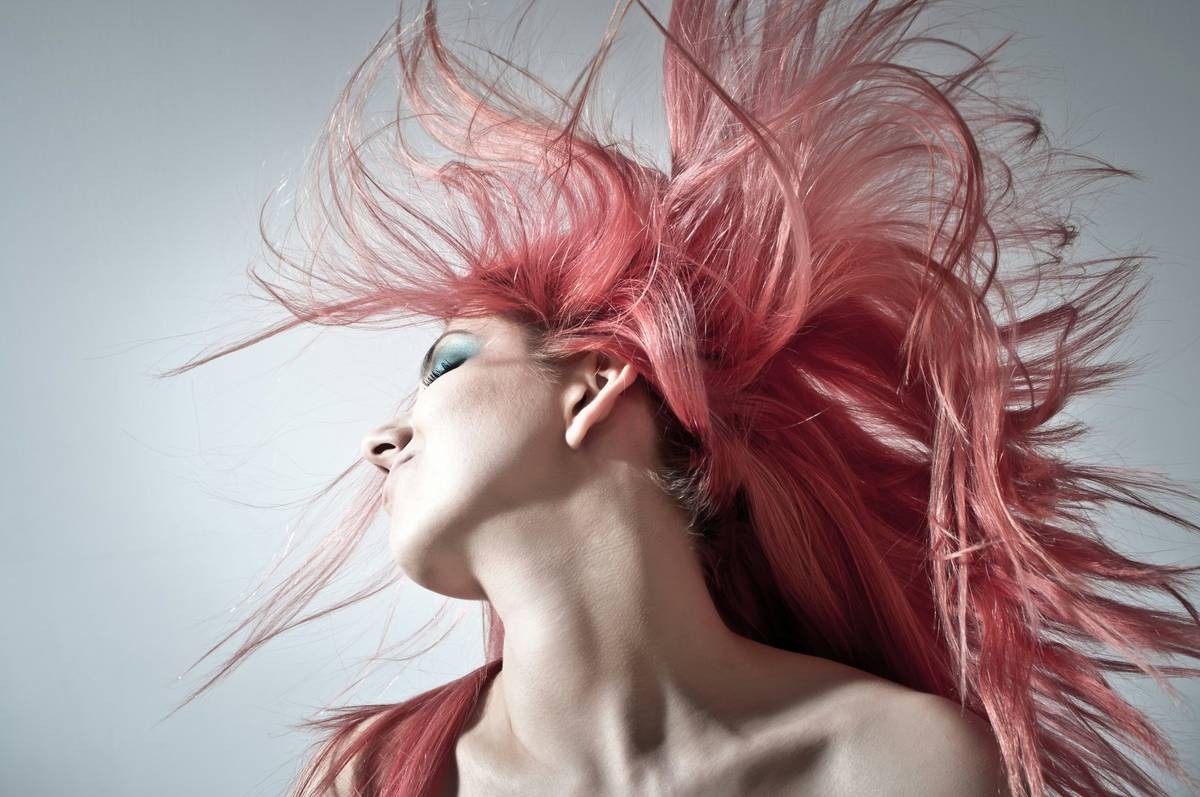 Close-up of hair strands gliding smoothly through comb after using tangle-free conditioner